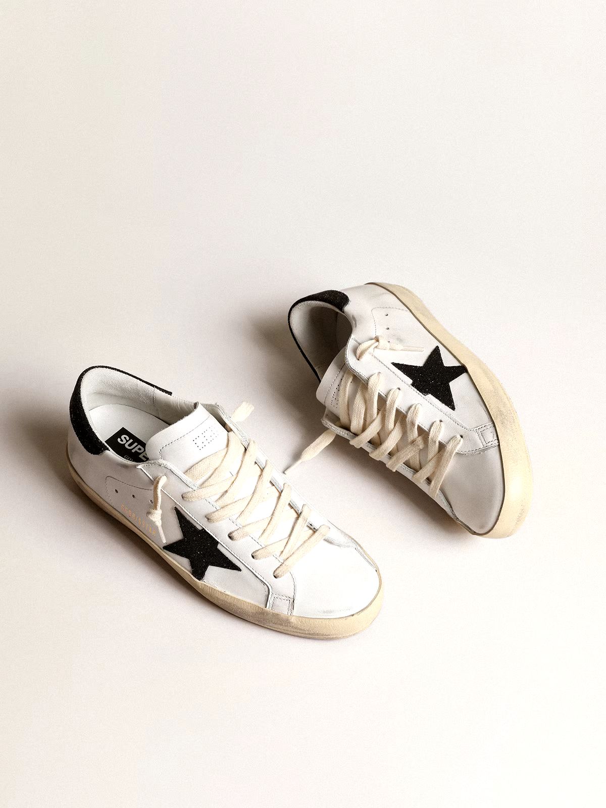 Super-Star Damen aus Nappa mit Stern aus goldfarbenem Glitzer und schwarzem Glitzer an der Fersenpartie